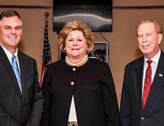 Commissioners Kiger, Honeycutt and Shue after their swearing-in ceremony at the Government Center